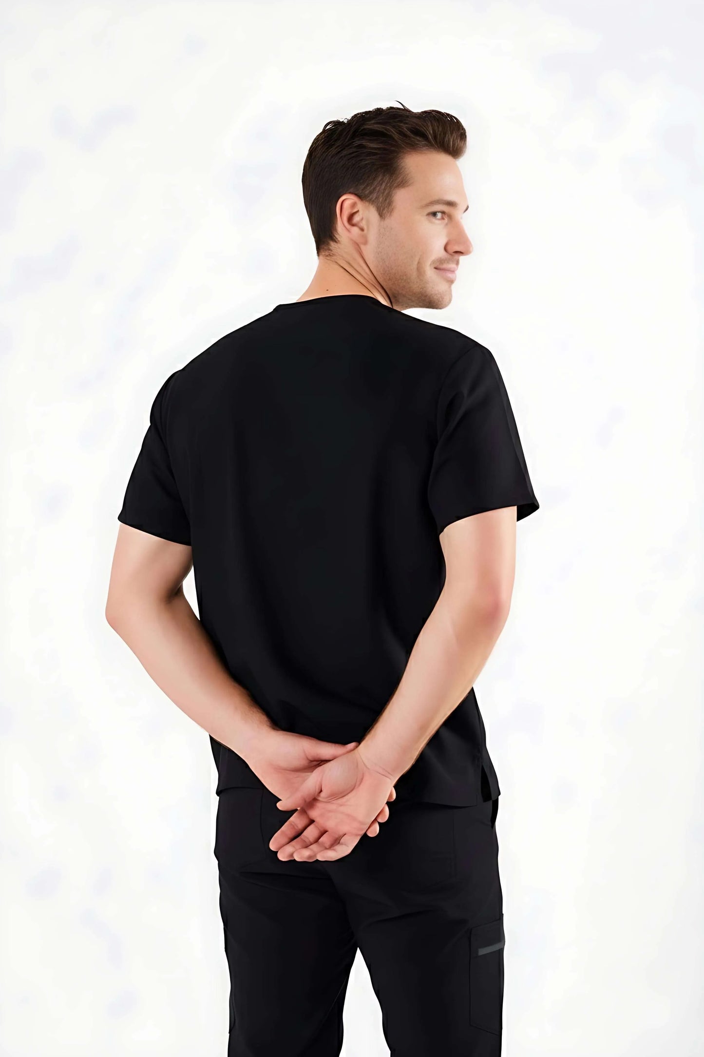 Man wearing a black t-shirt and pants on a white background