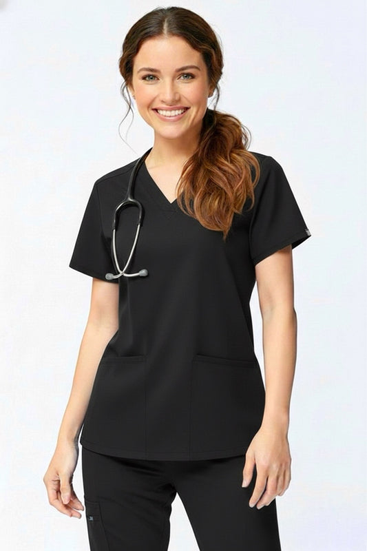 Woman wearing a black scrub top with a stethoscope on a white background