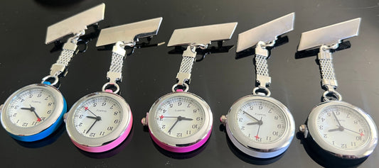 Set of five pocket watches on a black background