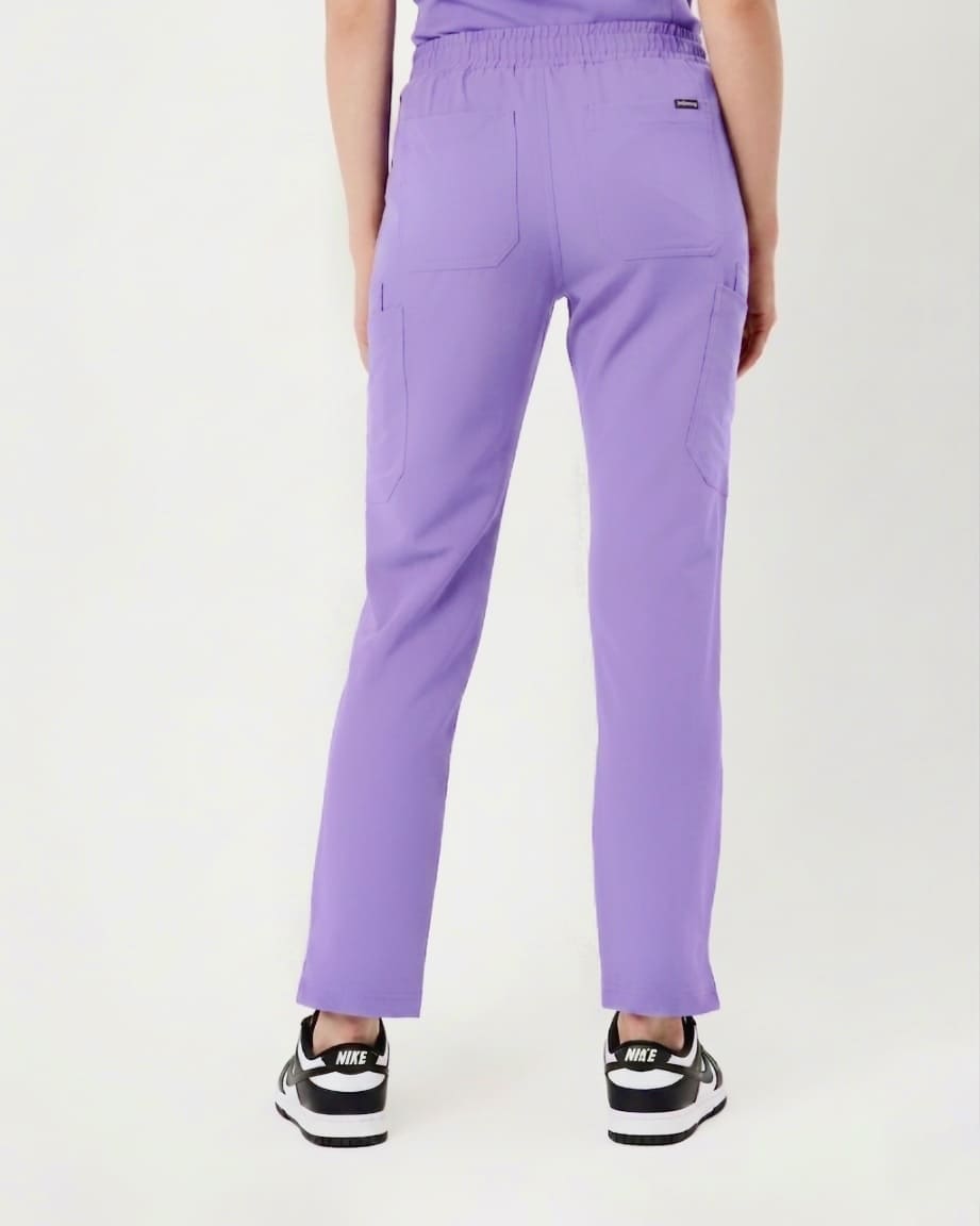 Purple pants worn by a person on a white background