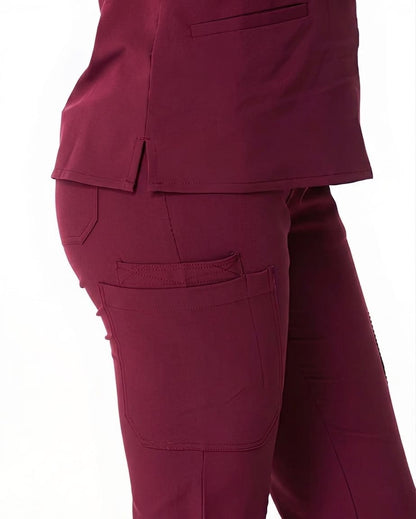 Maroon scrub pants on a white background