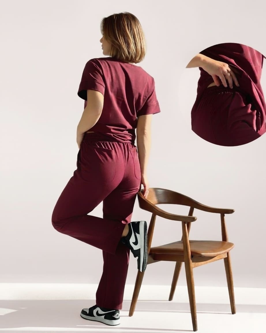 Person wearing a maroon outfit with a chair and close-up of fabric texture.