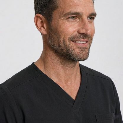 Man wearing a black shirt against a plain background
