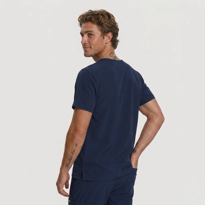 Man wearing a navy blue t-shirt and shorts on a light gray background