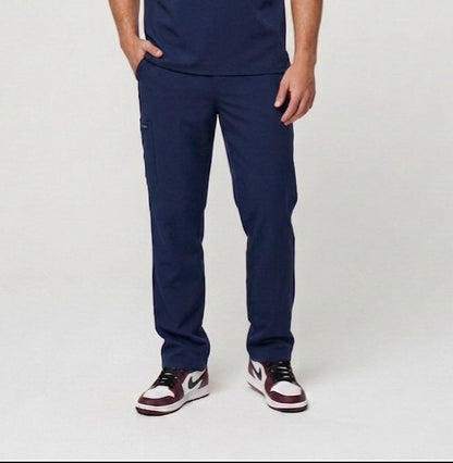 Man wearing navy blue scrubs on a white background