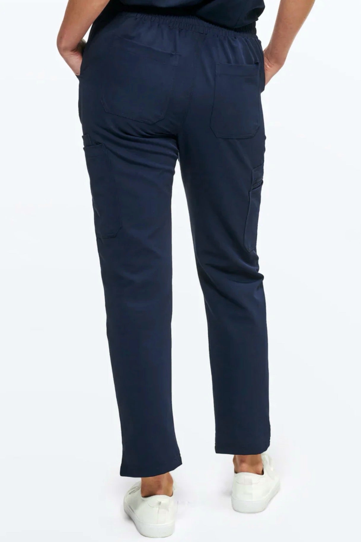 Navy blue pants worn by a person on a white background