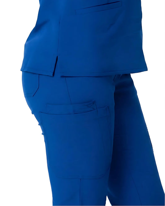Close-up side view of a person wearing bright royal blue scrub-style pants and matching top against a plain white background.