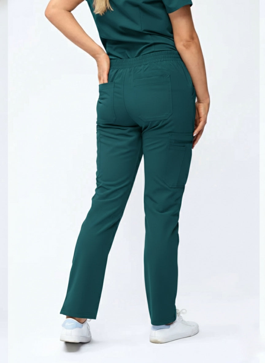 Person wearing teal scrubs with a white background