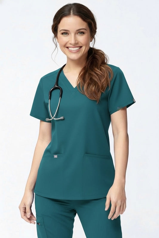 Woman wearing teal medical scrubs with a stethoscope on a white background